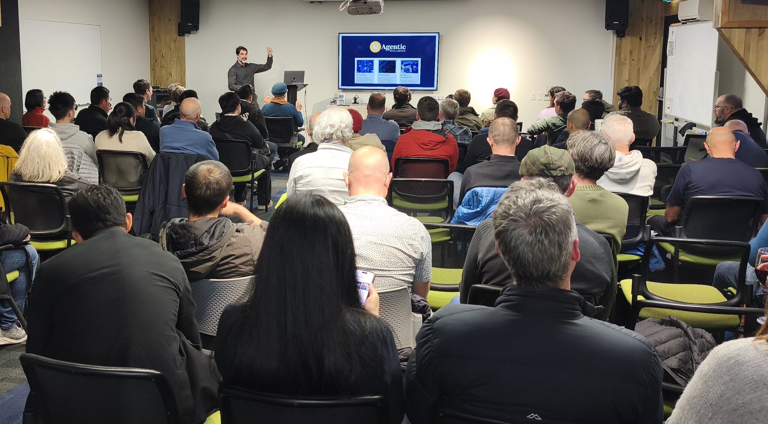 Caelan Huntress speaking at a workshop